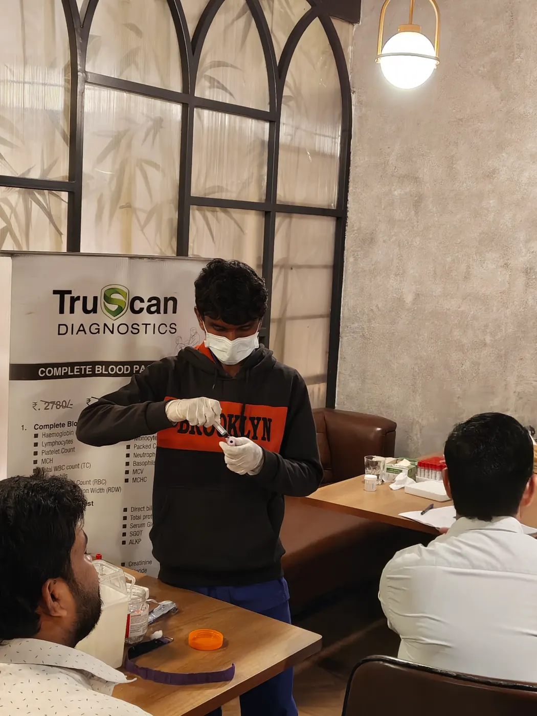 TruScan Diagnostics complete blood package banner at an on-site test camp